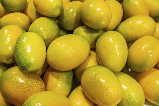 close up kumquat fruits on background