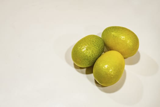 close up kumquat fruits on background