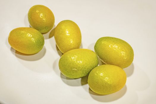 close up kumquat fruits on background
