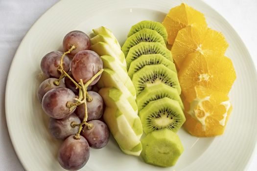 ready to eat sliced mixed fruits in plate