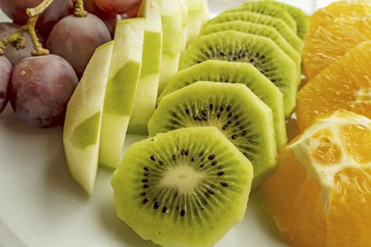 ready to eat sliced mixed fruits in plate