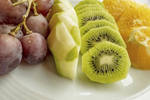 ready to eat sliced mixed fruits in plate