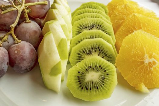 ready to eat sliced mixed fruits in plate