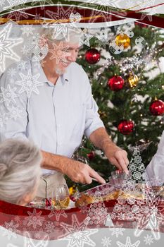 Grandfather carving turkey at christmas against christmas frame