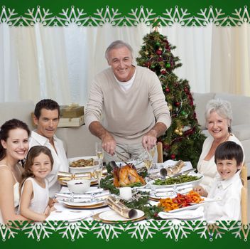 Grandfather cutting turkey for Christmas dinner against snowflake frame