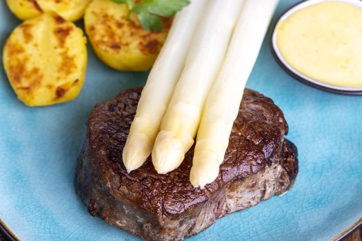 asparagus with potatoes and a steak