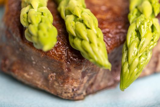 asparagus with potatoes and a steak