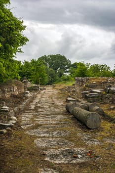 Ancient stone path and ruins in Dion site, Greece.