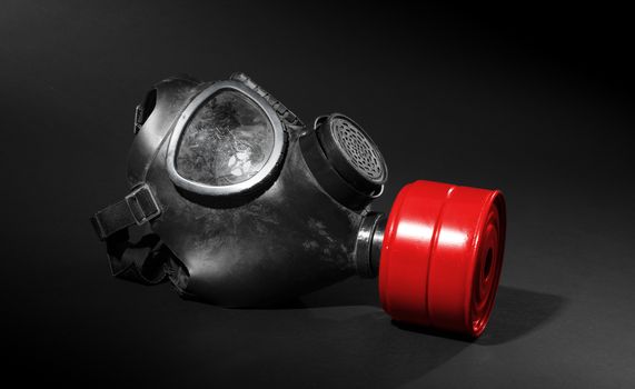 Vintage gasmask isolated on black background - Red filter