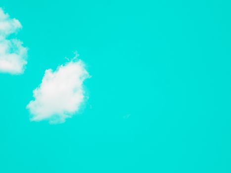 Abstract clouds on cyan pastel sky