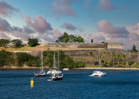 Sailboats in bay off Martinique by old French Fort