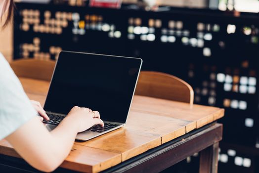 Business young female lifestyle freelance working using on laptop computer in coffee shop