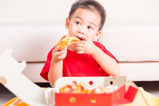 Hot Homemade, Vegetarian fast Italian food, Cute Little Child enjoying eating Delivery Pizza pepperoni, cheese many slices deliciously in an open cardboard box at home