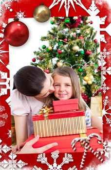 Mother and daughter at home at Christmas against christmas themed page