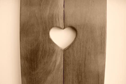 Heart shape carved in wood.