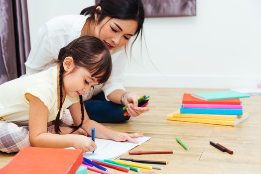 Child kid girl kindergarten drawing teacher education mother with beautiful mother at interior room home