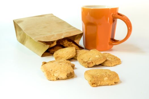 Cookies in a paper bag and a cup of coffee