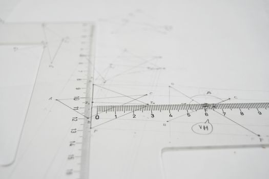 Technical drawing with rulers, set square, triangle, papers