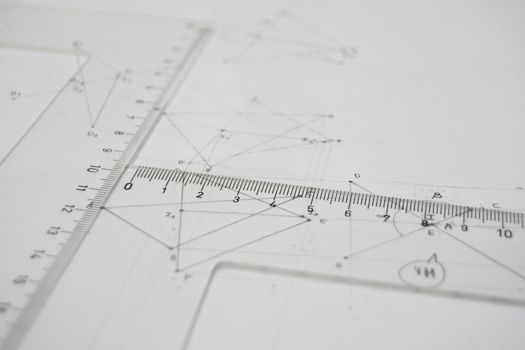 Technical drawing with rulers, set square, triangle, papers