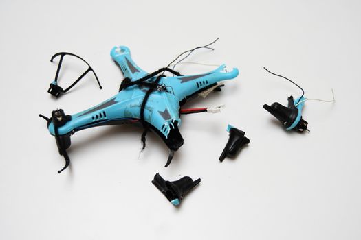 Mini blue crashed broken drone