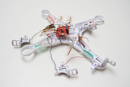 White crashed broken drone