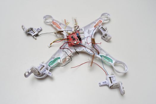 White crashed broken drone