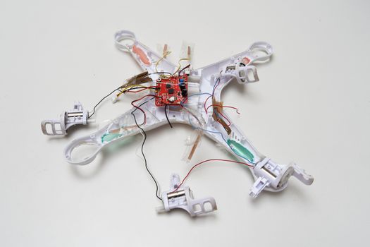 White crashed broken drone