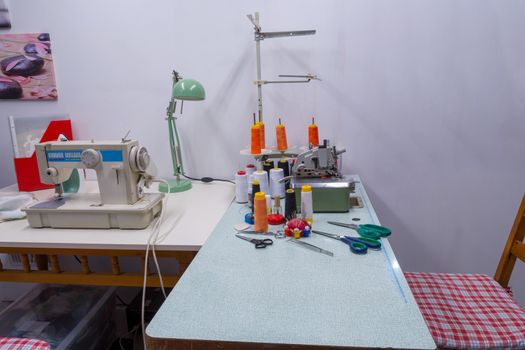 A place for a seamstress in a small sewing studio of fashionable clothes