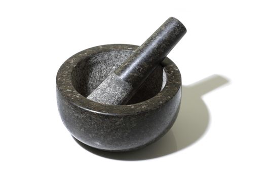 A mortar and pestle on white with shadow