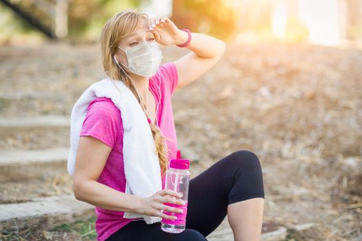 Girl Wearing Medical Face Mask During Workout Outdoors.