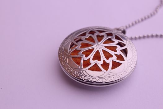 Essential oil infuser used as pendant of a necklace