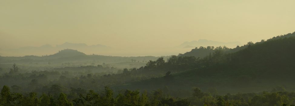 Morning mist drifting over the  mountain view in the countryside of Thailand
