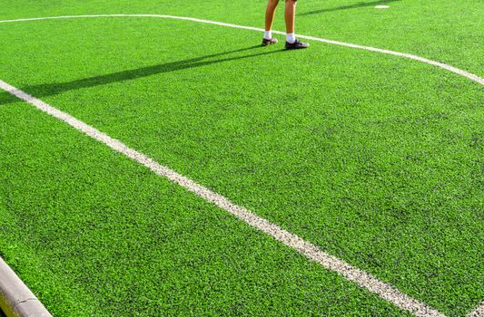 Child play on the artificial turf of the school