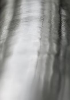 Texture of shiny surface and scratched on stainless steel round bar, industrial grunge background