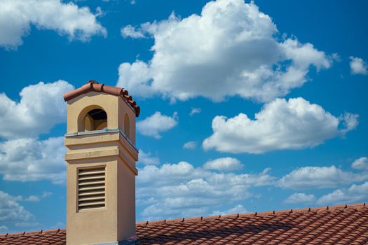 Plaster tropical resort hotel with a red tile roof