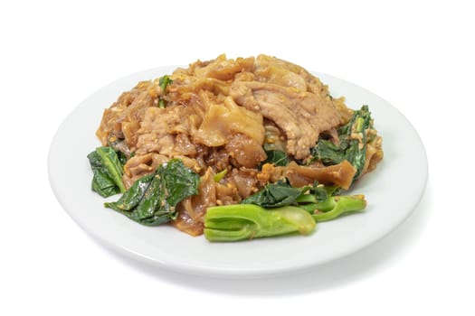 The close up of Fried Noodle with soy sauce on white plate on white background.