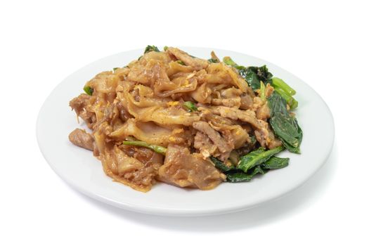 The close up of Fried Noodle with soy sauce on white plate on white background.