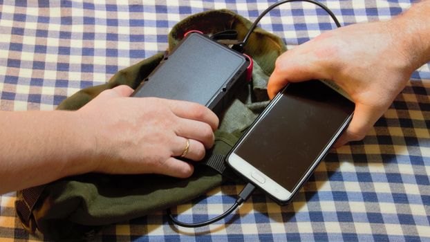 solar power bank charges bushcraft army cell phone