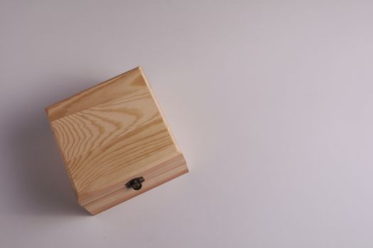 Wooden box on white background, for secrets. The wishes