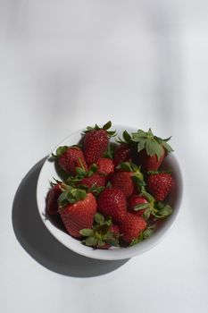 Bowl full of ripe strawberries ready to eat. Colors of nature