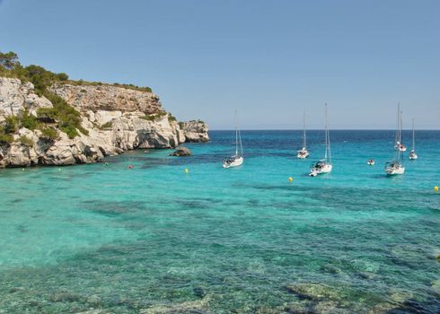 Sailboats waiting in the calm and blue sea, quiet