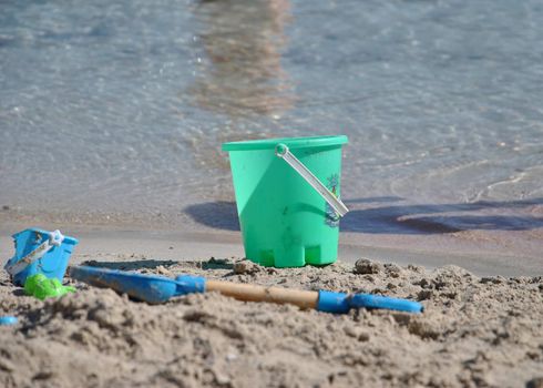 Children toys to play on the beach, Playing in the sand. The bright summer