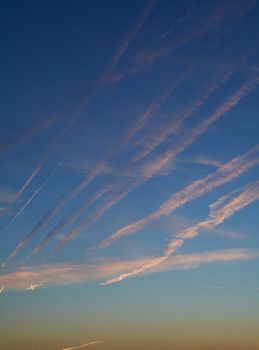 Intense blue sky with small white clouds