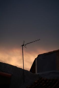 Aerial in sad mountain village at sunset