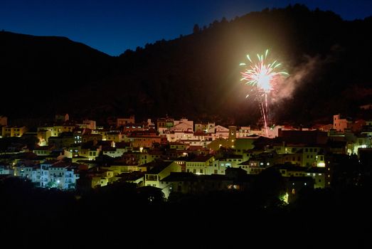 Small town in the mountains, with fireworks