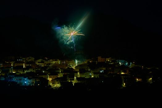 Small town in the mountains, with fireworks