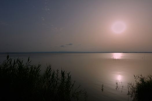 Reflections of the sunset in the lagoon. Sunset lights