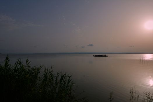 Reflections of the sunset in the lagoon. Sunset lights