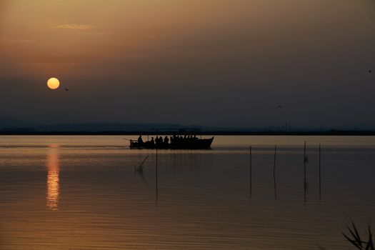 Reflections of the sunset in the lagoon. Sunset lights