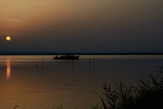 Reflections of the sunset in the lagoon. Sunset lights